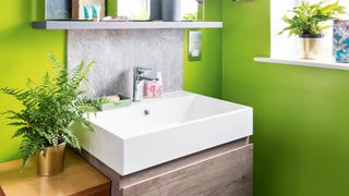 Lime green painted bathroom showing why bright green is a named as top paint color that can devalue a house