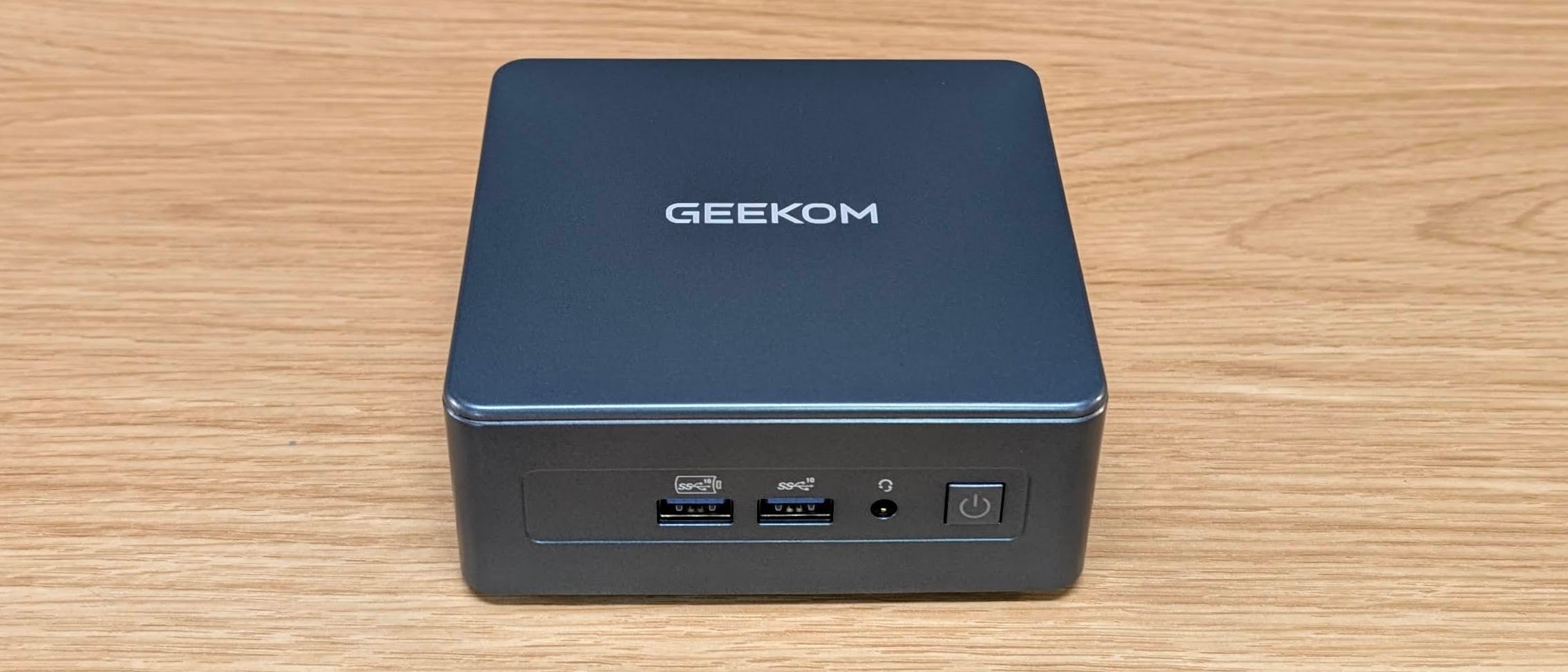 Geekom IT12 mini PC on a desk