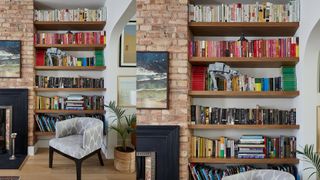 bookshelves in brick alcove showcasing the bookshelf wealth trend