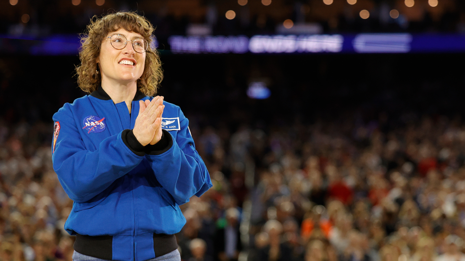 Photo of Koch in front of a crowd at a basketball game in April 2023