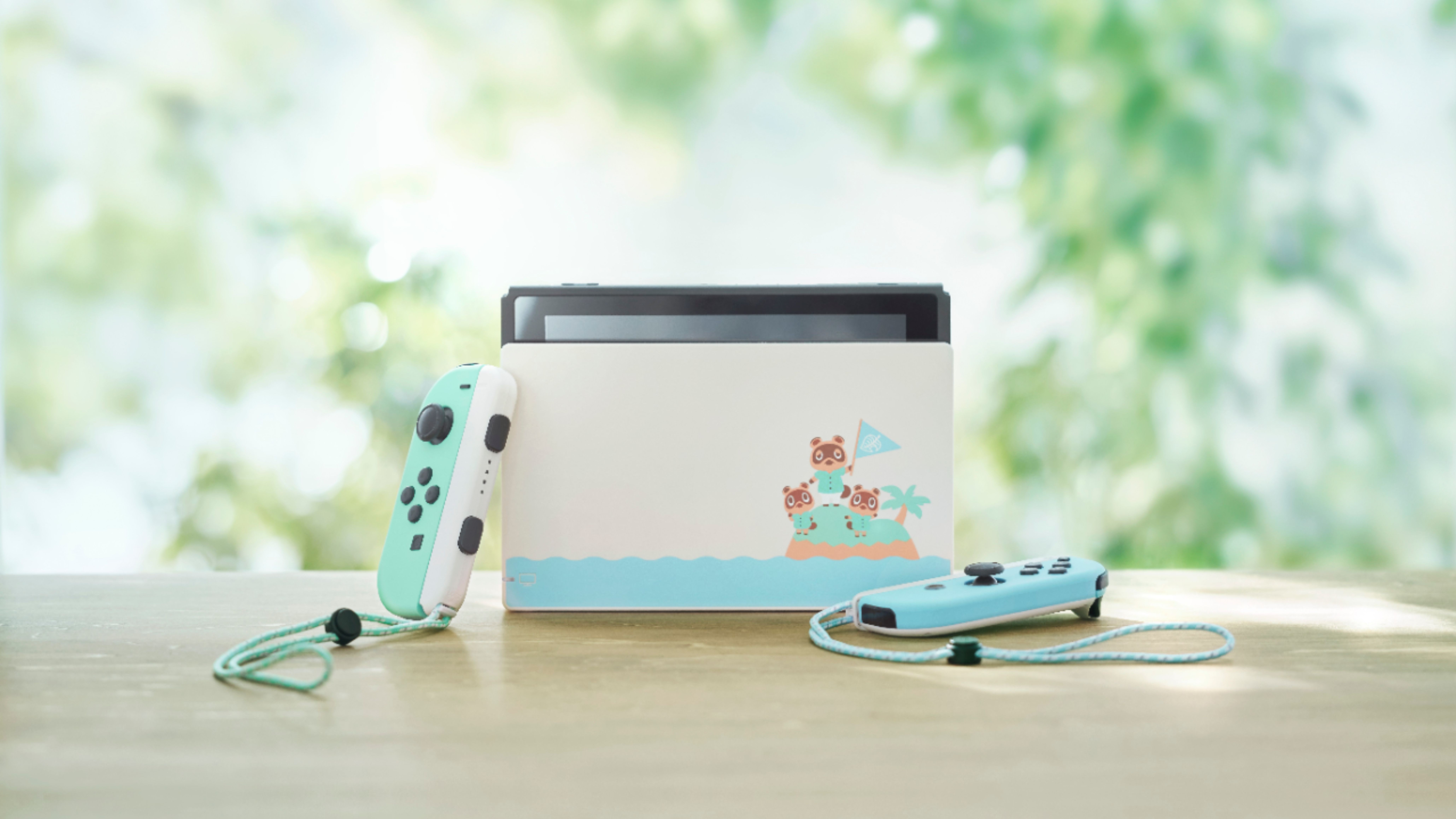 animal crossing new horizons switch on wooden table in front of blurry trees