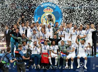 Real Madrid celebrate with the trophy after the 2018 Champions League final