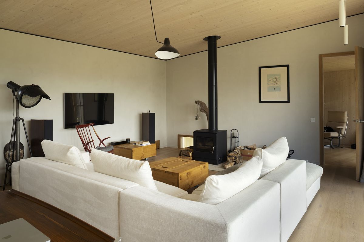 woodburning stove in timber clad living room