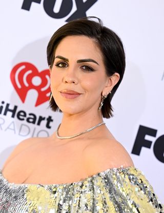 katie maloney with short hair styled in a pixie cut.