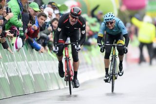 Stefan Kung holds of Andrey Grivko to win stage 2 at Tour de Romandie