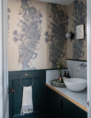 Small bathroom with dark green panelling and bathroom wallpaper