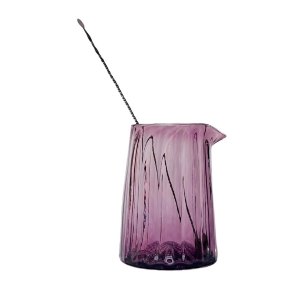 Purple glass cocktail mixing glass with spoon
