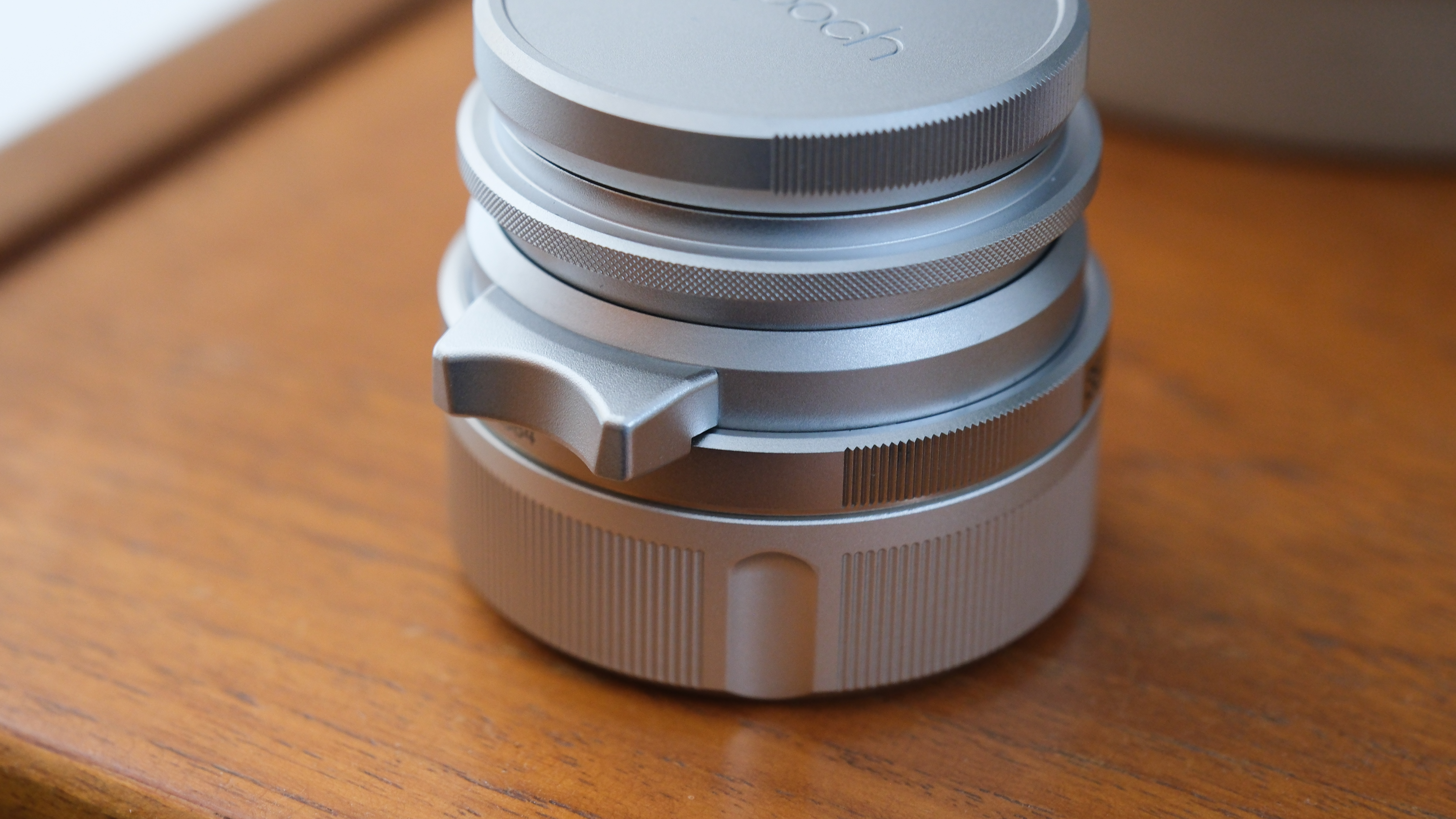 Close-up of the Thypoch Ksana 35mm lens barrel and focus tab