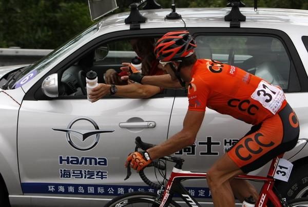 A Polish rider from CCC Polsat Polkowice grabs a drink bottle.