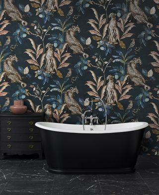 black bath with dramatic leopard wallpaper