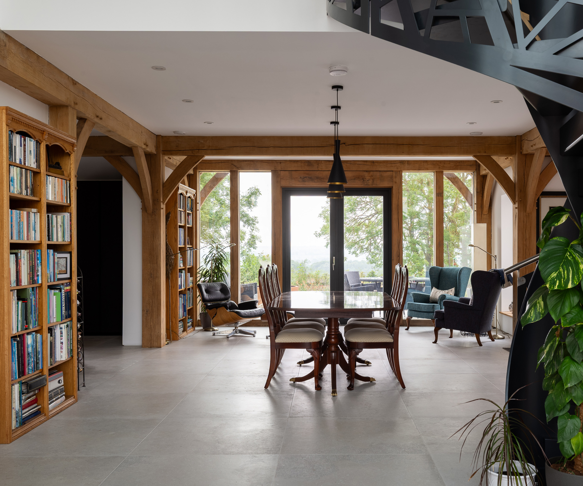 Dining room with views outside to countryside and books on left wall