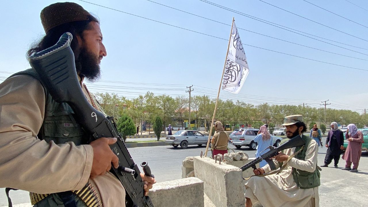 Taliban fighters stand guard outside the Interior Ministry in Kabul 