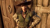 Windrose - The leader of the Smugglers, Marita Suarez. She has long brown curly hair and is wearing a large pirate hat and green doublet. 