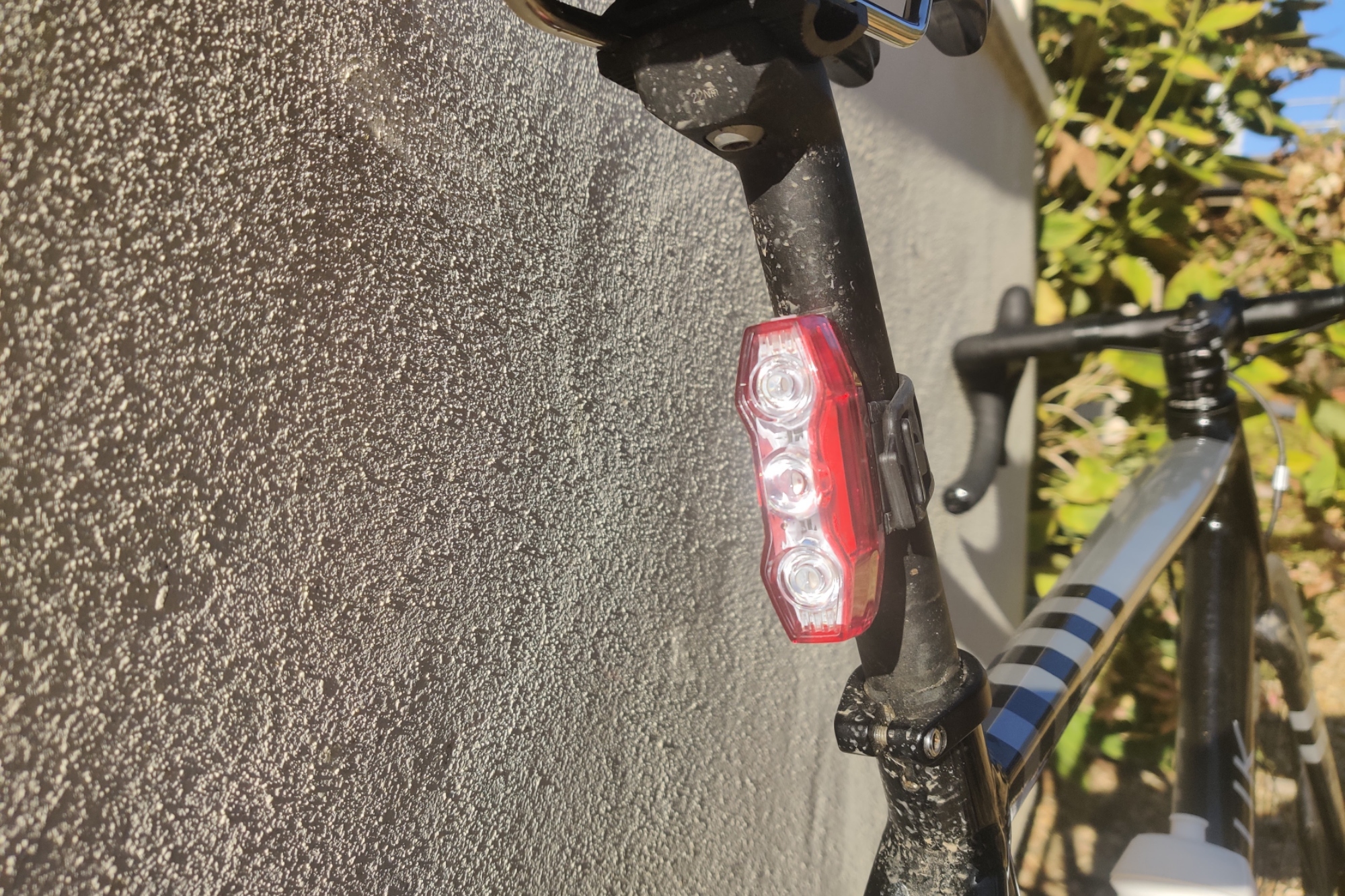 Image shows CatEye's ViZ300 rear light mounted to a bike.