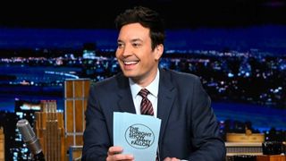 Host Jimmy Fallon sits at his desk on The Tonight Show Starring Jimmy Fallon