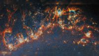 a curl of red-and-white gas on a black starry background