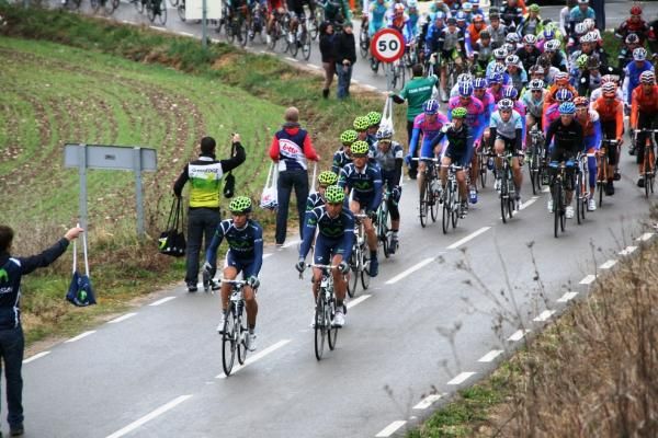 The peloton rides through the feedzone.