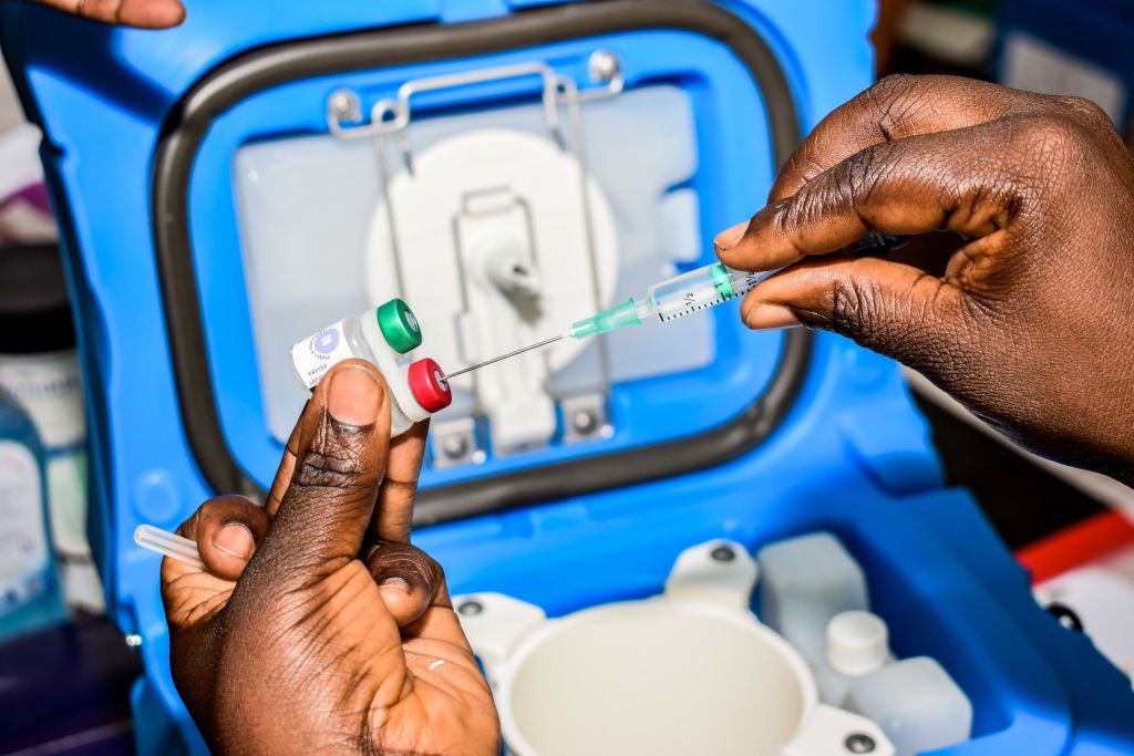 A health worker measures the dosage of malaria vaccine in Ndhiwa, Homabay County, western Kenya