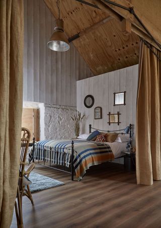 large barn home bedroom with curtains