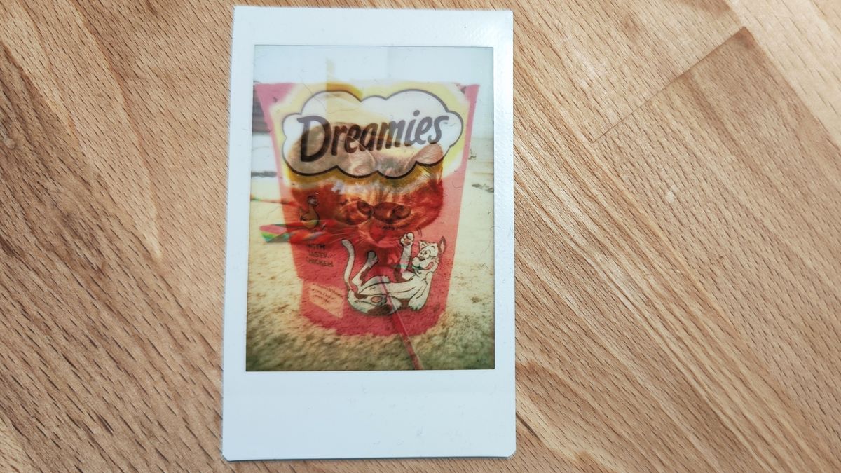 Instant photos on a wooden table