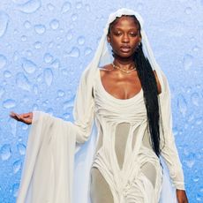 Three models. Two have wet-looking hair, one has a wet-looking dress