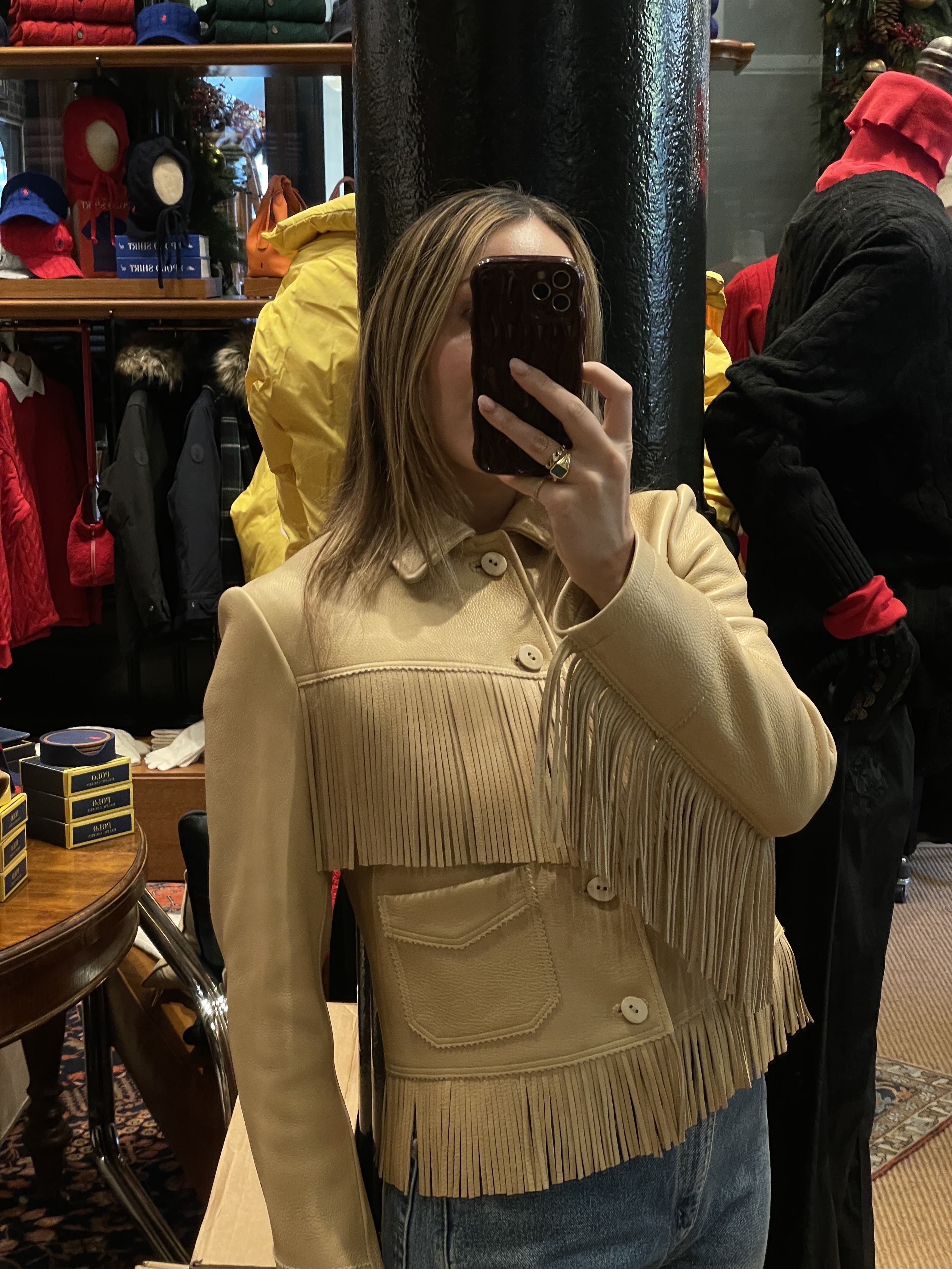 Who What Wear senior fashion editor Anna LaPlaca wearing a beige leather fringe jacket at the Polo Ralph Lauren store in New York