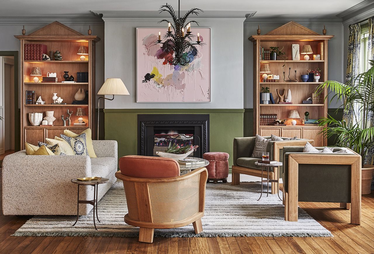 living room with blue and green walls and a pink chair