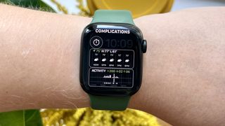 Apple Watch 7 with weather complication on screen