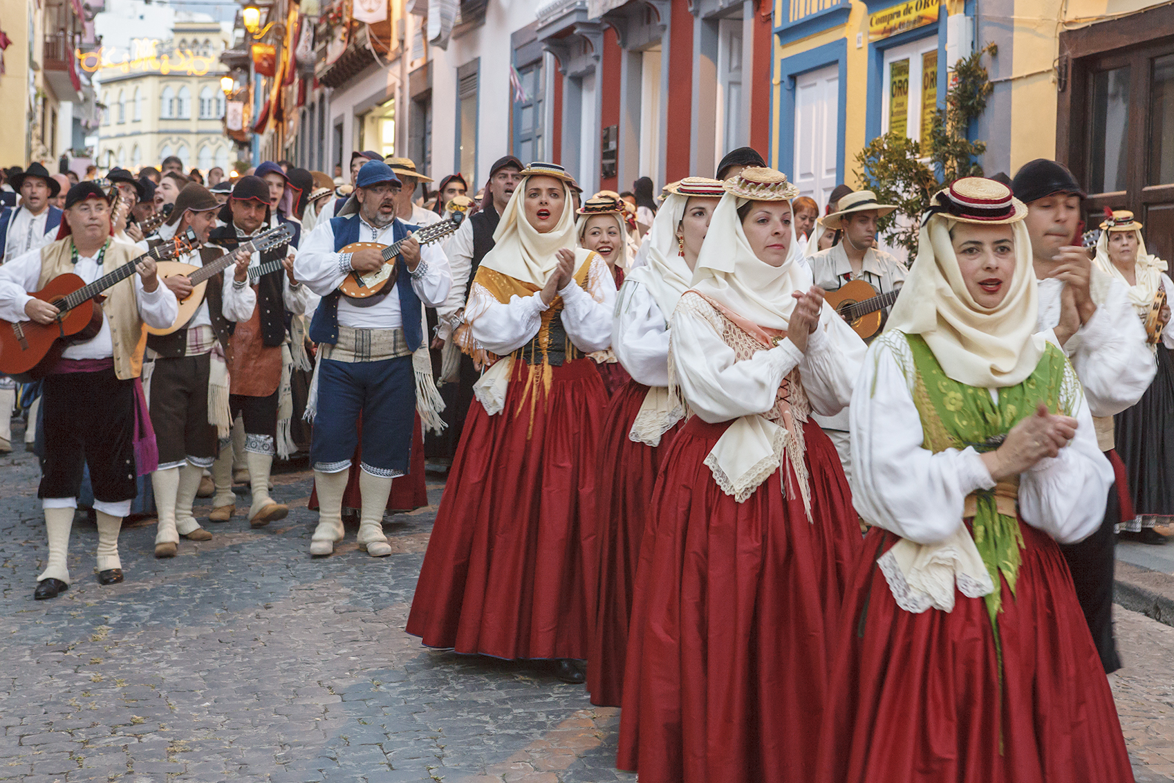 Santa Cruz de la Palma, Spain - July 4, 2010: People in traditional clothing playing music and parading along the main street of Santa Cruz de la Palma during the Bajada de la Virgen de las Nieves, a traditional folk festival which takes place every five years between July and August.