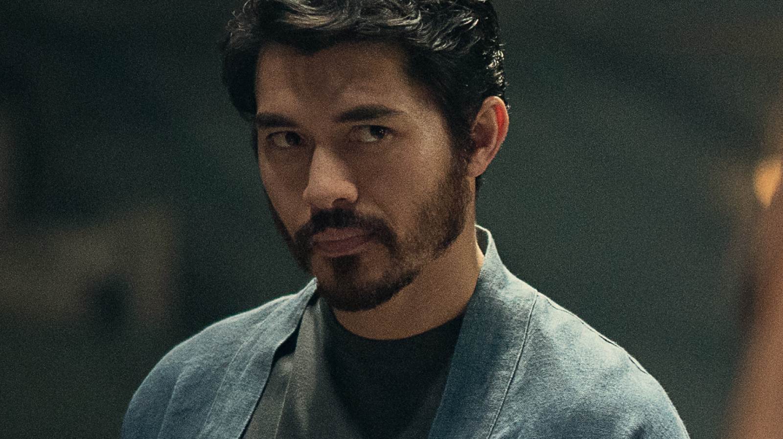 Henry Golding looking forward in The Old Guard 2