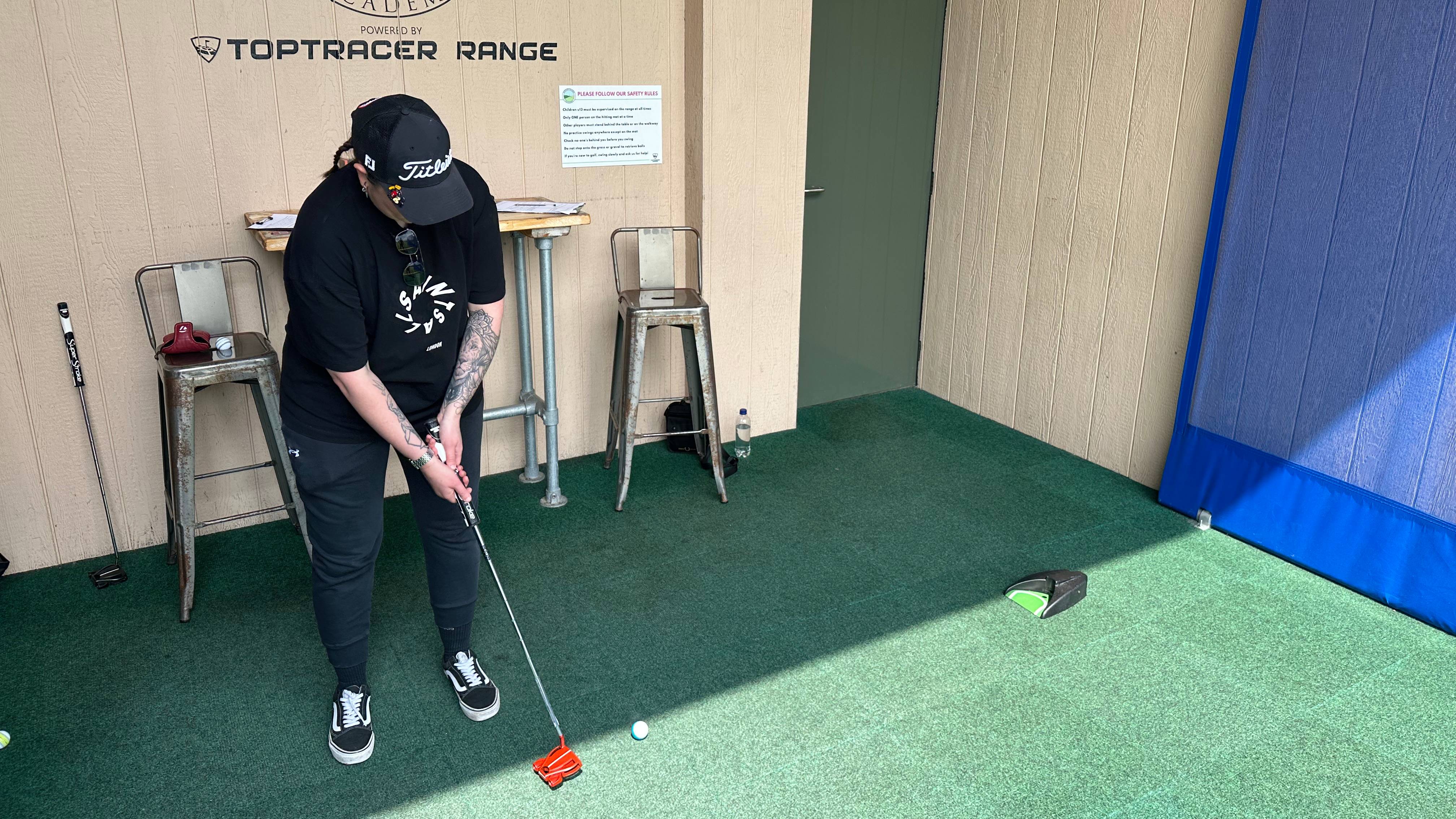 Auto putt returner training aid