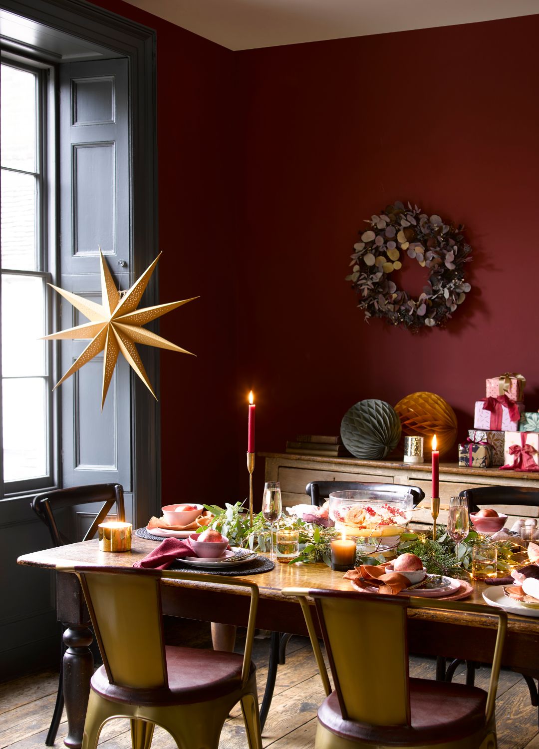 picture of christmas table with red decor and candles