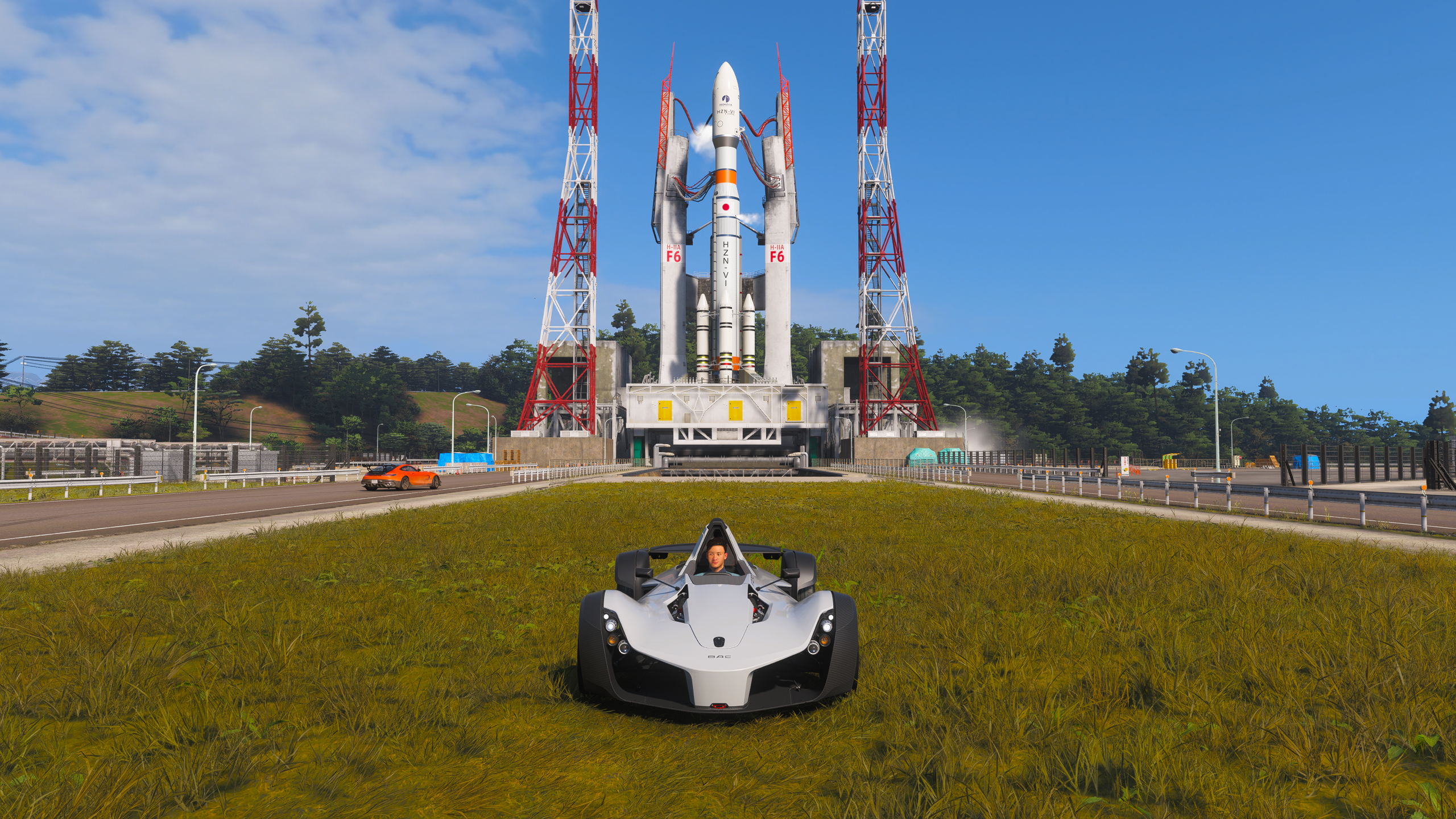 Forza Horizon 6 Track Toys: A BAC Mono parked by the rocket in the Irokawa Space Centre.