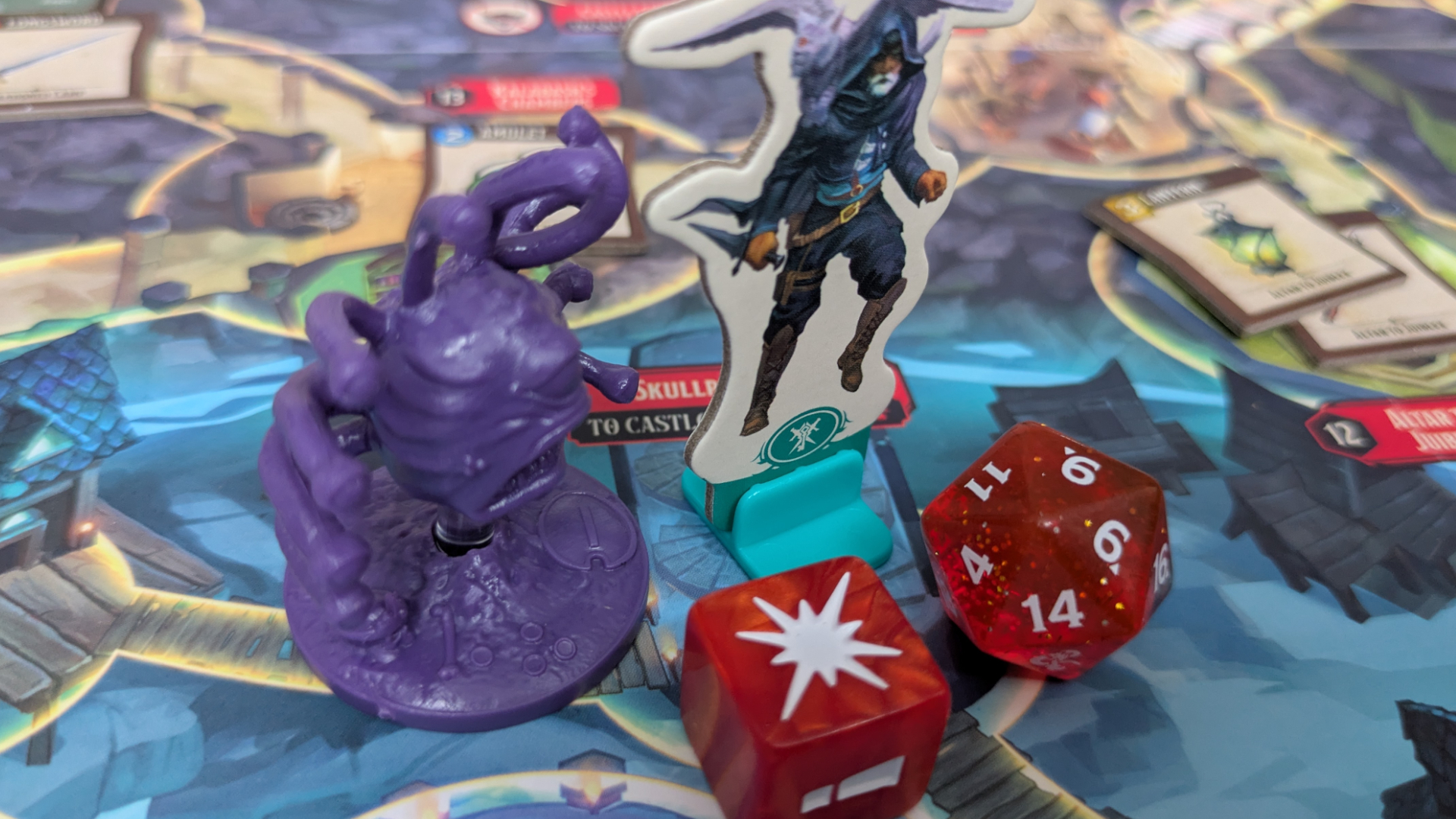 Horrified: Dungeons &amp;amp; Dragons Beholder and character token beside two dice, all on the board