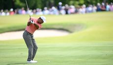 Tiger Woods at the top of his backswing from the fairway