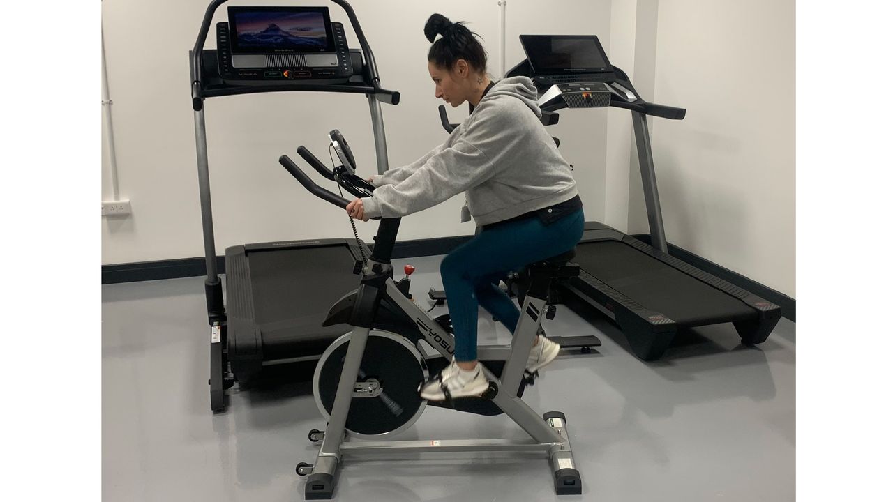 Woman riding Yosuda exercise bike