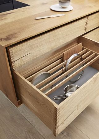 kitchen island drawer open with pan lid dividers