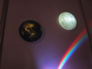 Uncle Milton's Earth in My Room and Moon in My Room seen lit up in the dark at Toy Fair 2012.
