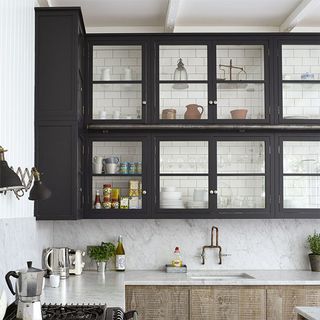 white kitchen with black cabinets and countertop