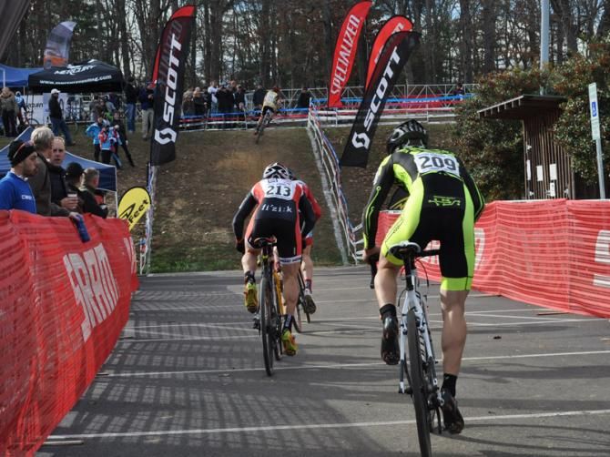 Brian Matter (RACC p/b Geargrinder) gets up the wall first early in the elite men's race with chasers in hot pursuit.