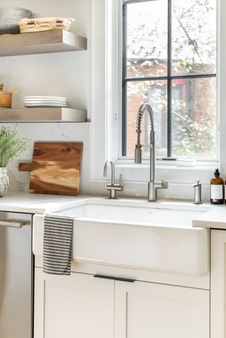 A photo of a white farmhouse-style sink