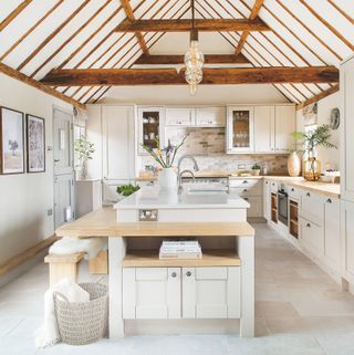 Wooden kitchen island in white kitchen