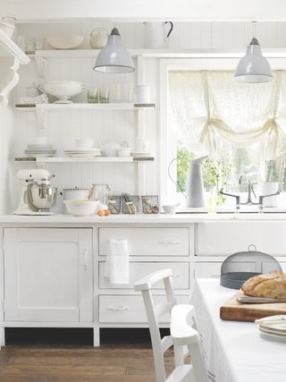 white country kitchen with white window drapes