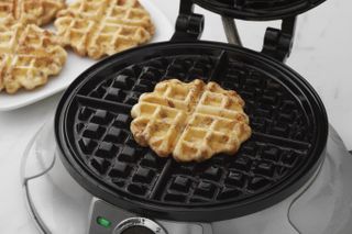 Waffle maker with a waffle inside