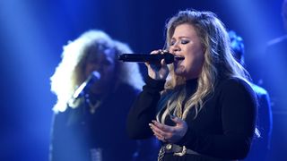 Kelly Clarkson performs on stage