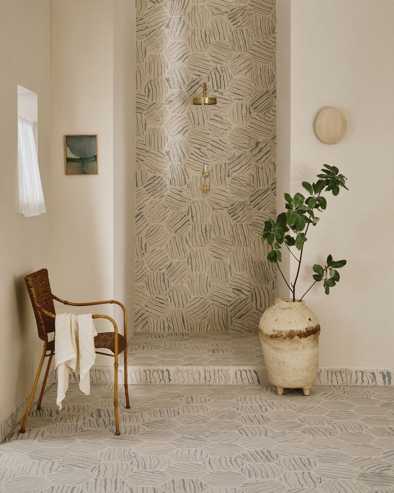 A bathroom with patterned tiles in hexagon shape