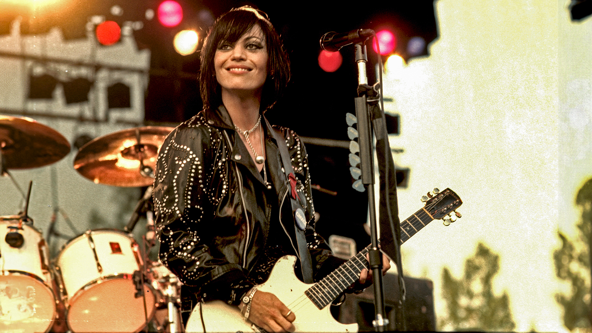 Joan Jett, born Joan Larkin, is shown performing on stage during a live concert appearance on August 1, 1993 in Agawam, Massachusetts.