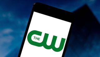 In this photo illustration The CW Television Network (The CW) logo is seen displayed on a smartphone. 
