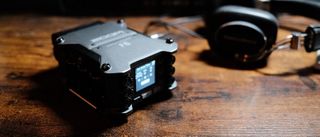 A Zoom F6 audio field recorder on a desk