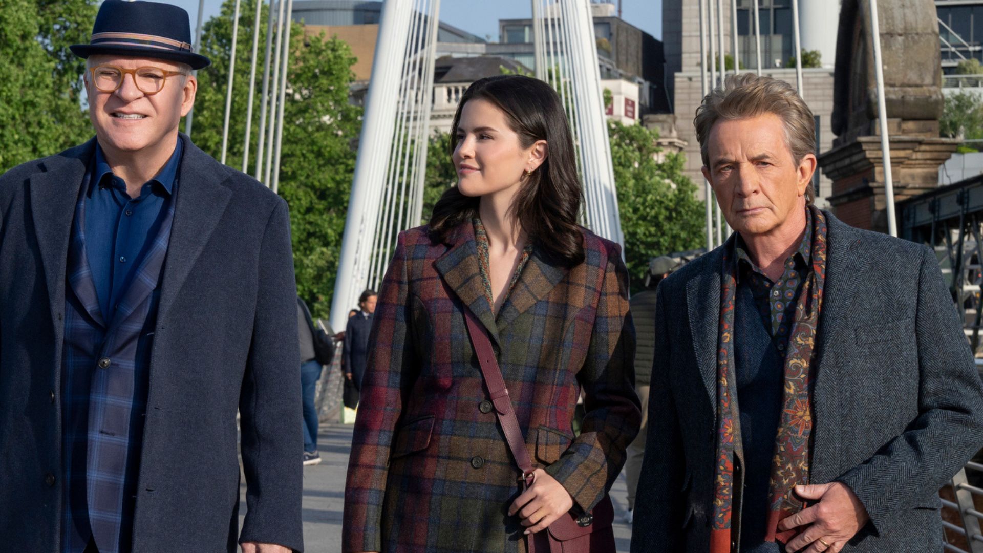 Charles, Mabel and Oliver walk across a bridge